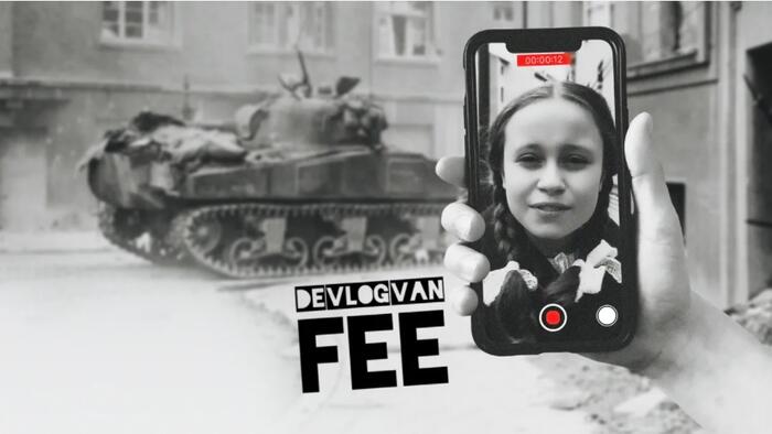 Smartphone met foto van een meisje. Op de achtergrond is een tank te zien. Ook te zien: de tekst 'De vlog van Fee'.